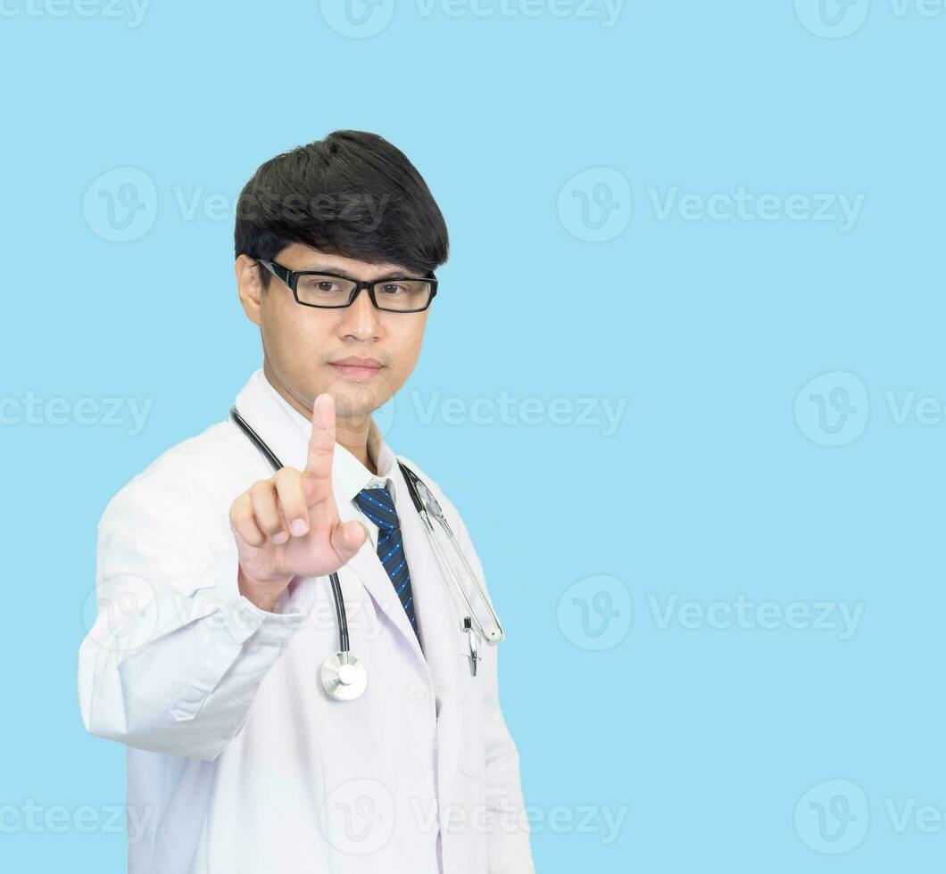 Asian man student scientist or doctor one person, wearing a white gown, standing, looking and smiling, blue background with a stethoscope auscultating the heart around his neck. photo