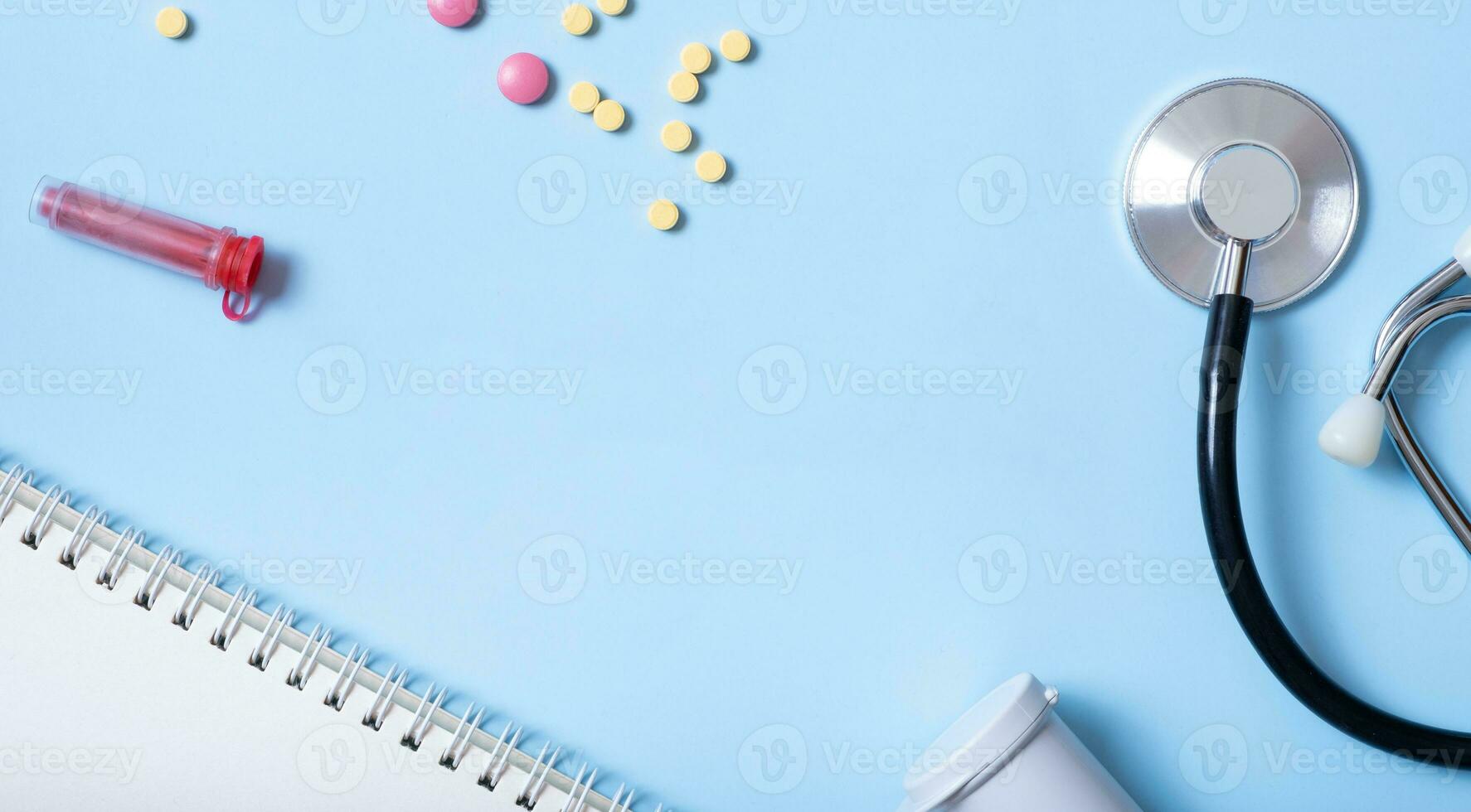 Banner with stethoscope, syringe, pills and copy space top view. Healthcare and medicine concept flat lay photo