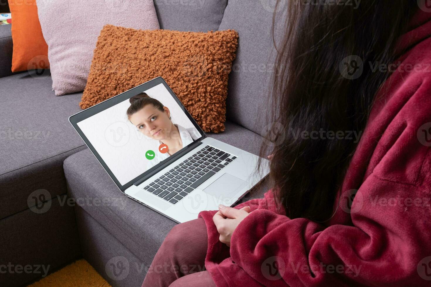 Calling a doctor online, treatment using telemedicine. A woman consults with a doctor online using  laptop photo