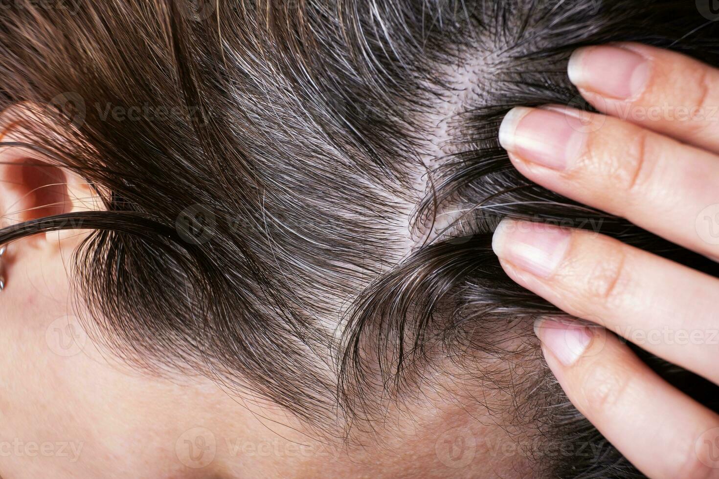 Close up of female hair with gray hair photo