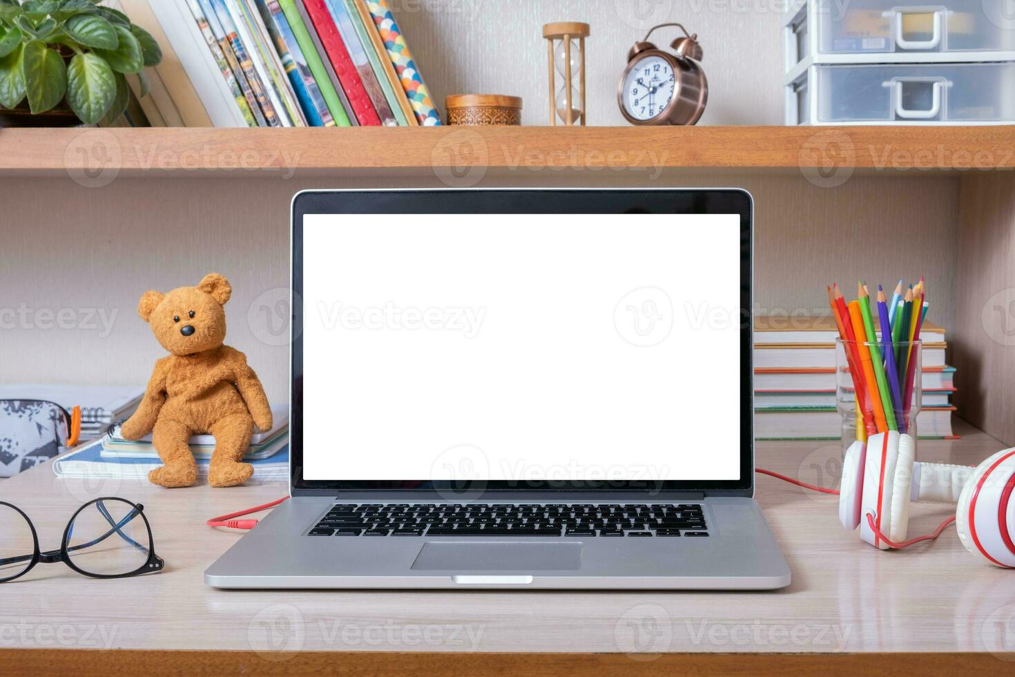 Laptop on desktop with blank screen in children's room. Kid education mockup, template photo