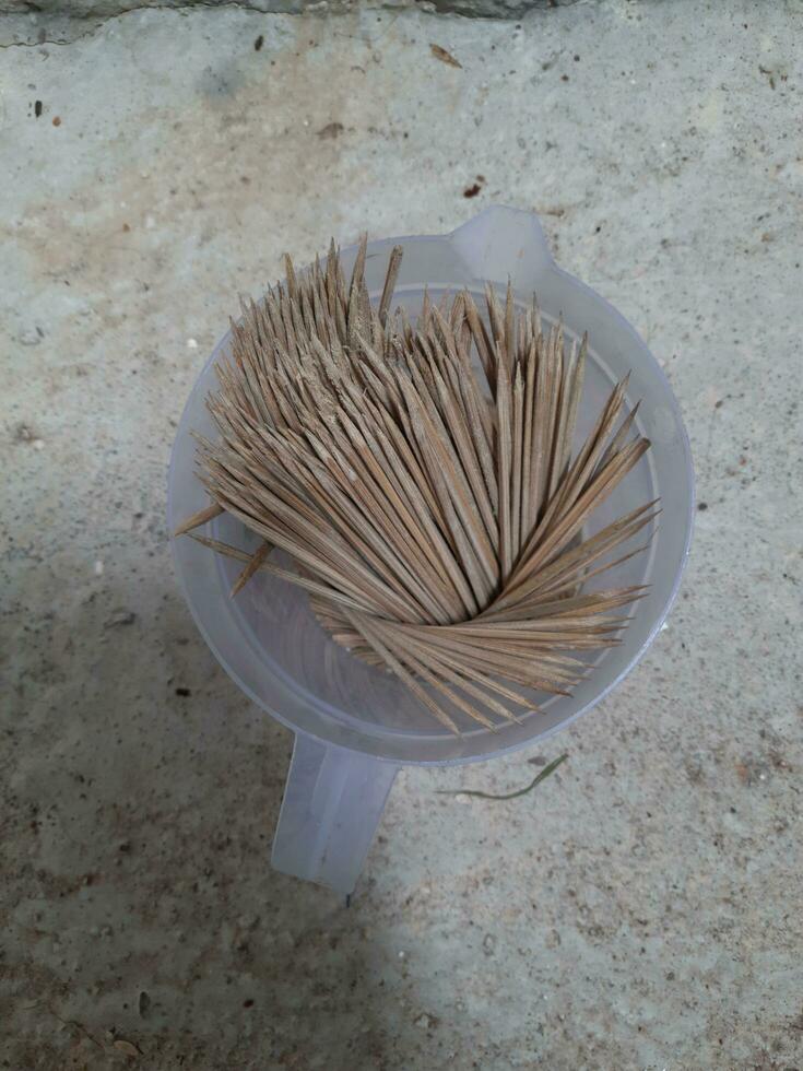 Kitchen Utensils, Pile of Wooden Sticks or Bamboo Skewers photo