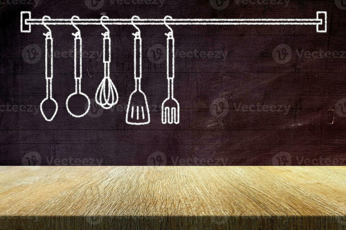 Wood Table with Kitchen Spoons in Chalk Drawing Style on Old Grunge Chalkboard Background, Suitable for Product Presentation Backdrop, Display, and Mock up in Food Concept. photo