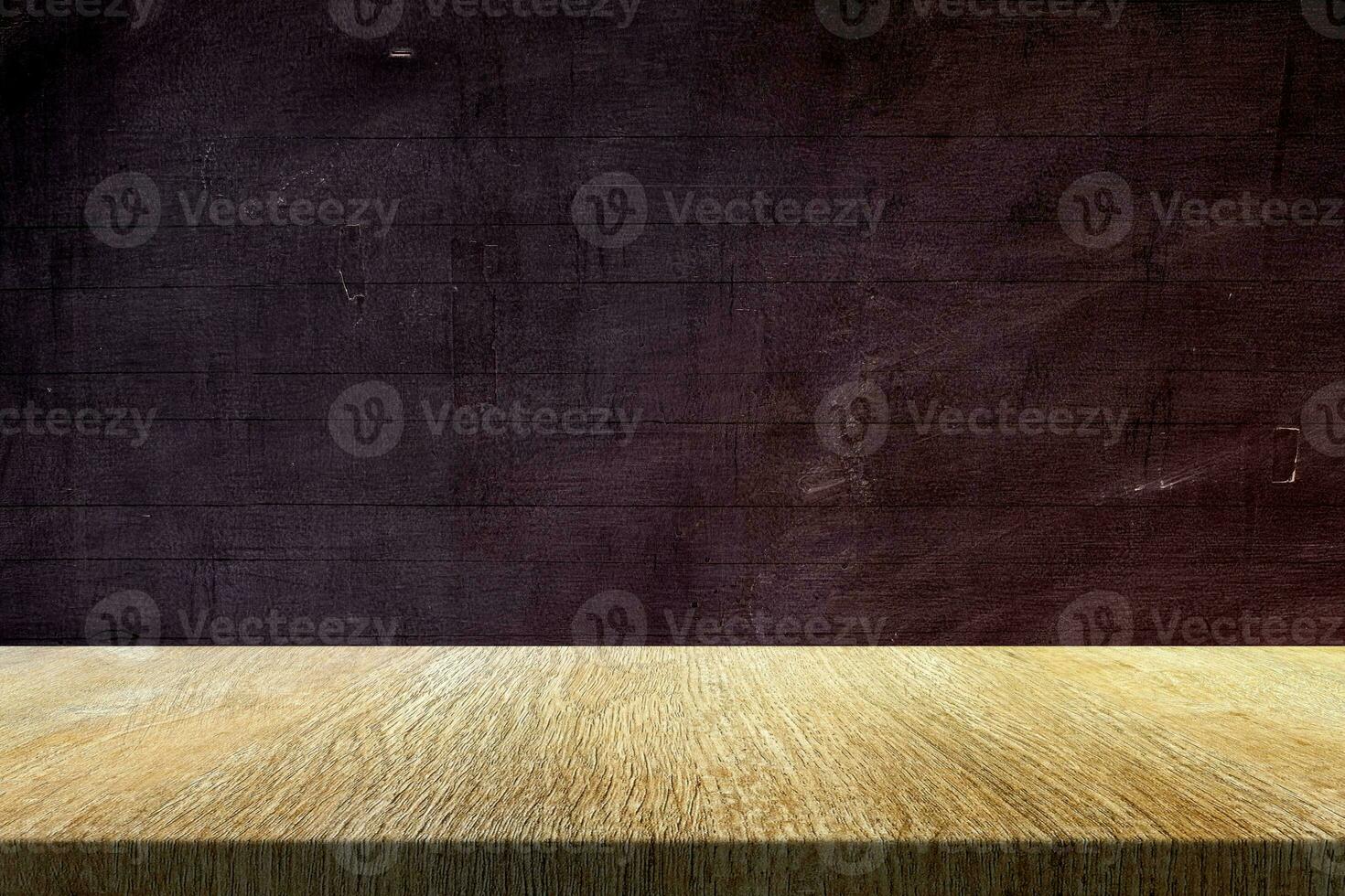 Wood Table with Old Grunge Blackboard Background, Suitable for Product Presentation Backdrop, Display, and Mock up in Education Concept. photo