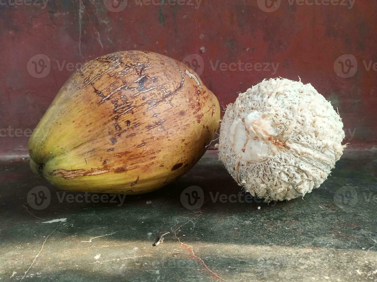 Tropical fruit open and intact coconut isolated photo