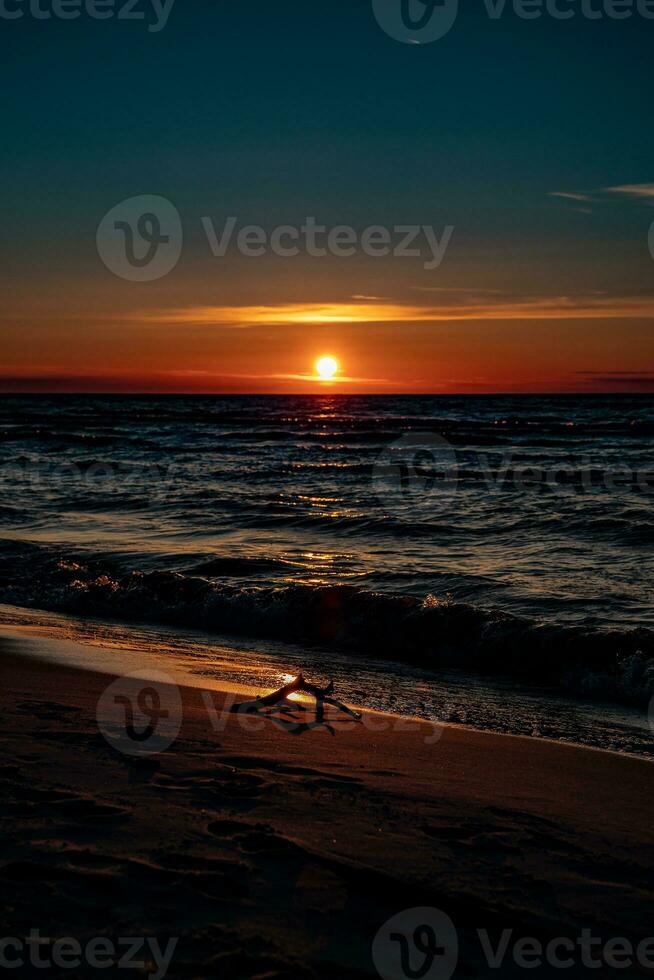 picturesque calm sunset with colorful clouds on the shores of the Baltic Sea in Poland photo