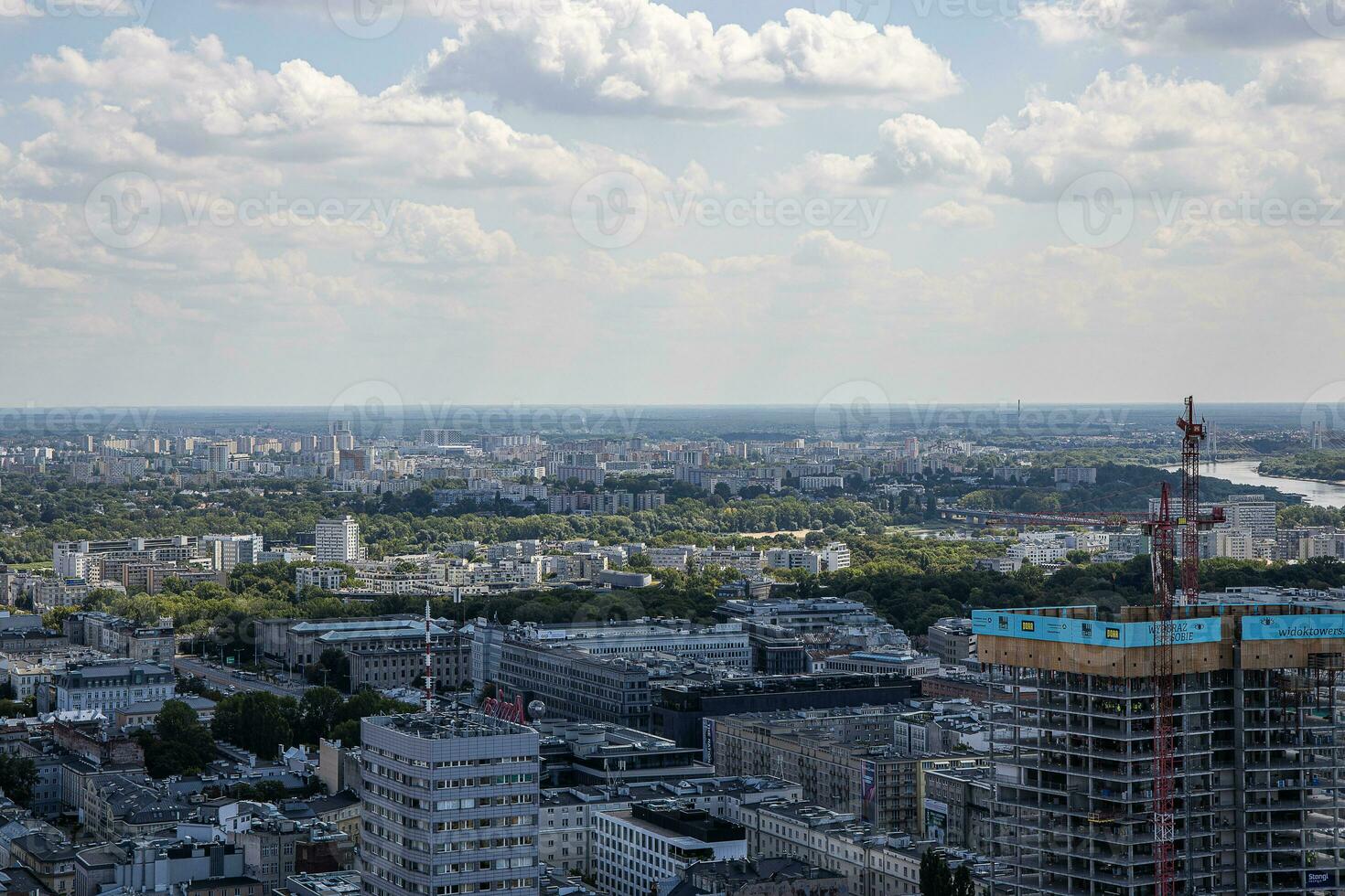 landscape of the city of Warsaw from the vantage point in the Palace of Culture on a warm summer sunny day photo