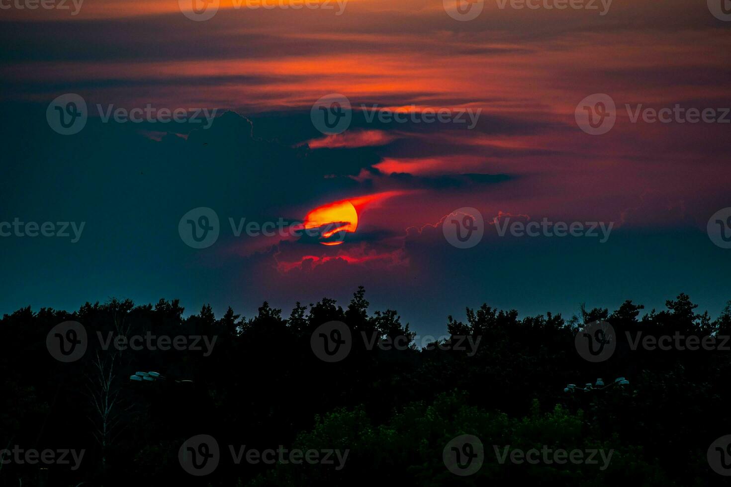 colorful sunset landscape with clouds and dramatic sky photo