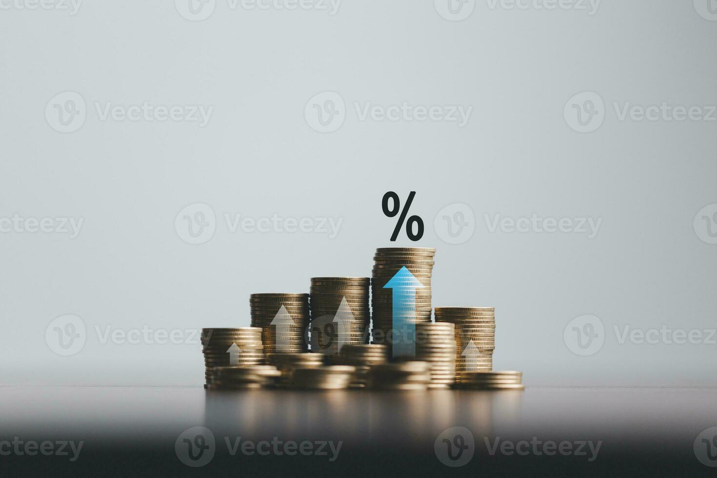 Stacked coins on wooden table with illustration shows increasing of interest rates, financial concept. Interest rate financial and mortgage rates. Icon percentage symbol and arrow pointing up. photo