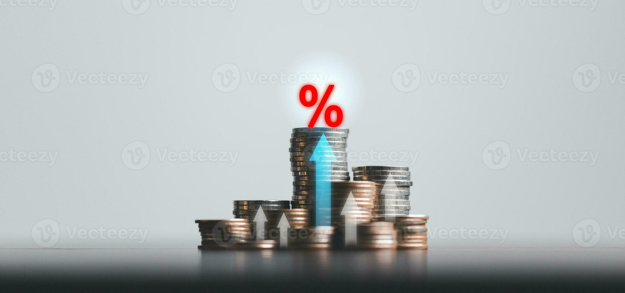 Stacked coins on wooden table with illustration shows increasing of interest rates, financial concept. Interest rate financial and mortgage rates. Icon percentage symbol and arrow pointing up. photo
