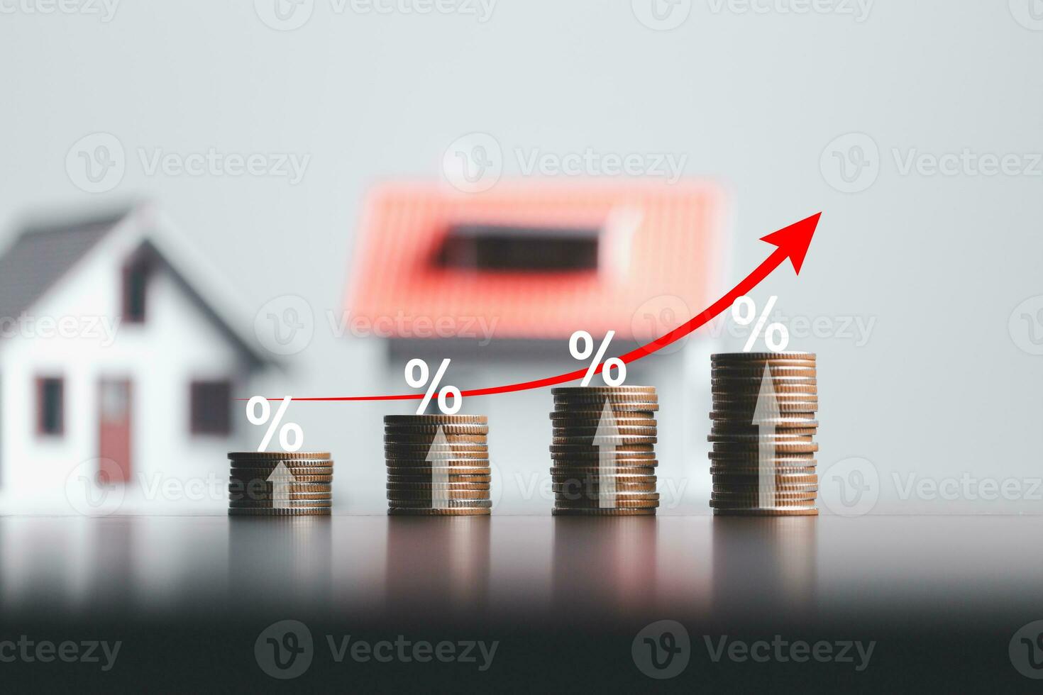 Stacks of coins and model house with percentage symbol for increasing interest rates. Interest rate financial and mortgage rates. Icon percentage symbol and arrow pointing up. Home price or increase. photo
