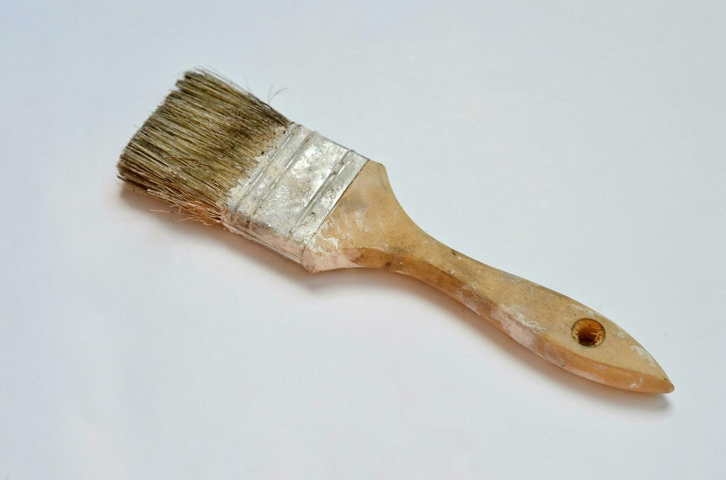 used paint brush isolated at white background photo