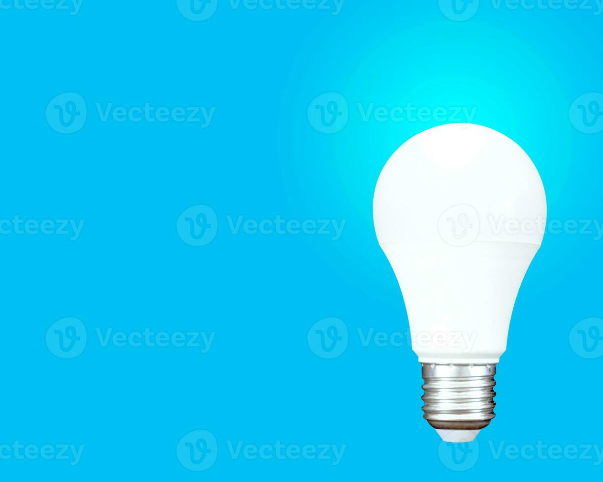 light bulb white on blue background. photo