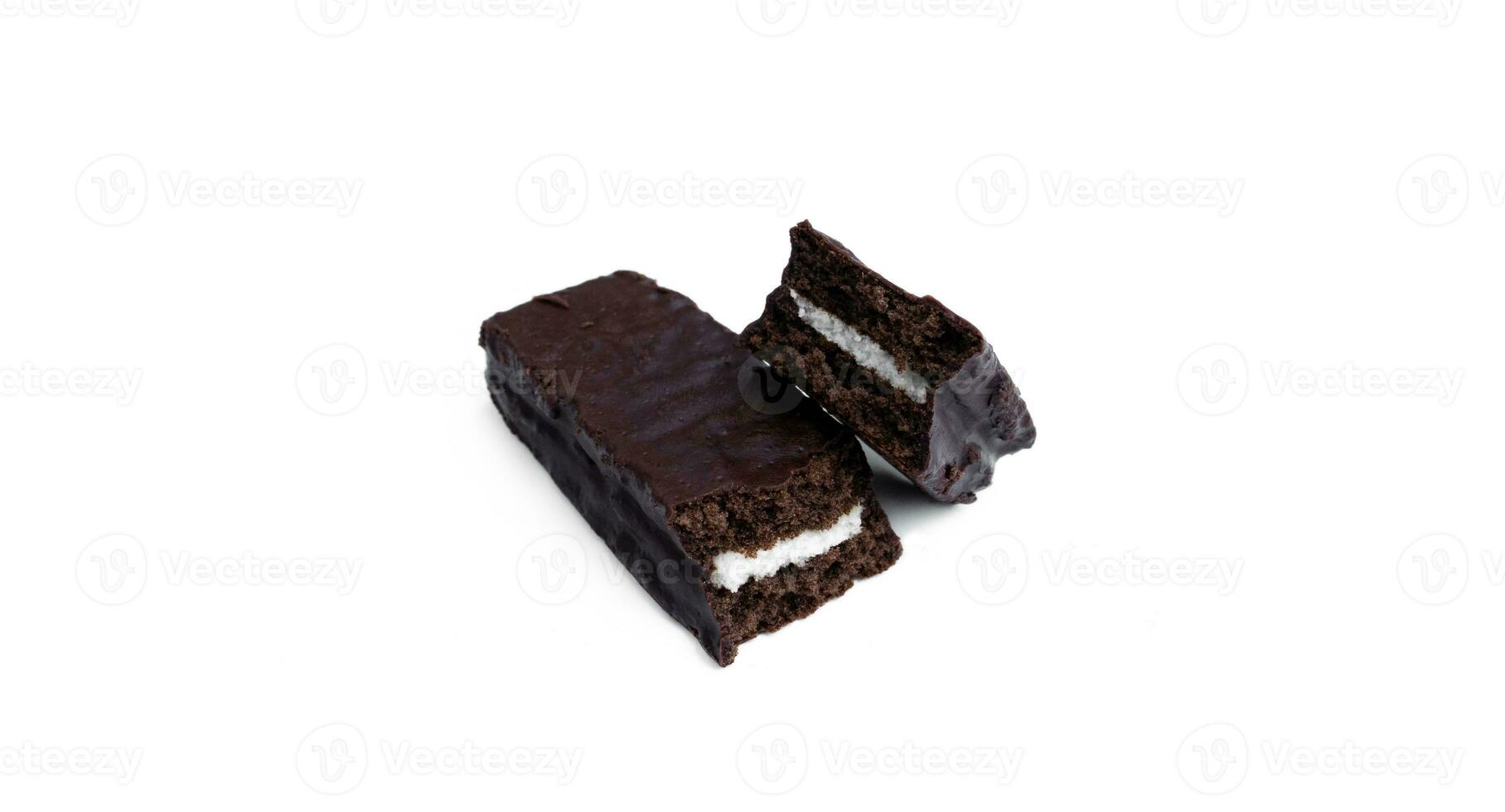 A chocolate soft cake filled with vanilla cream isolated on white background, after some edits. photo