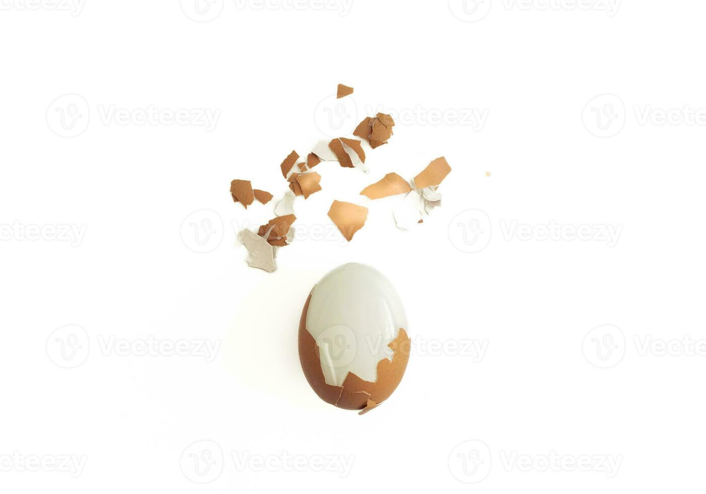 Cracked boiled egg isolated on white background, after some edits. photo