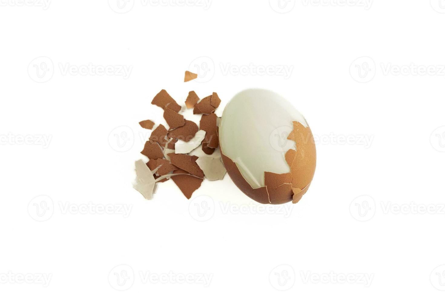 Cracked boiled egg isolated on white background, after some edits. photo