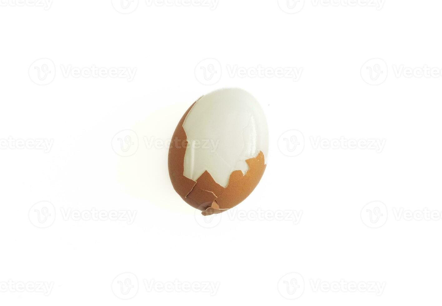 Cracked boiled egg isolated on white background, after some edits. photo