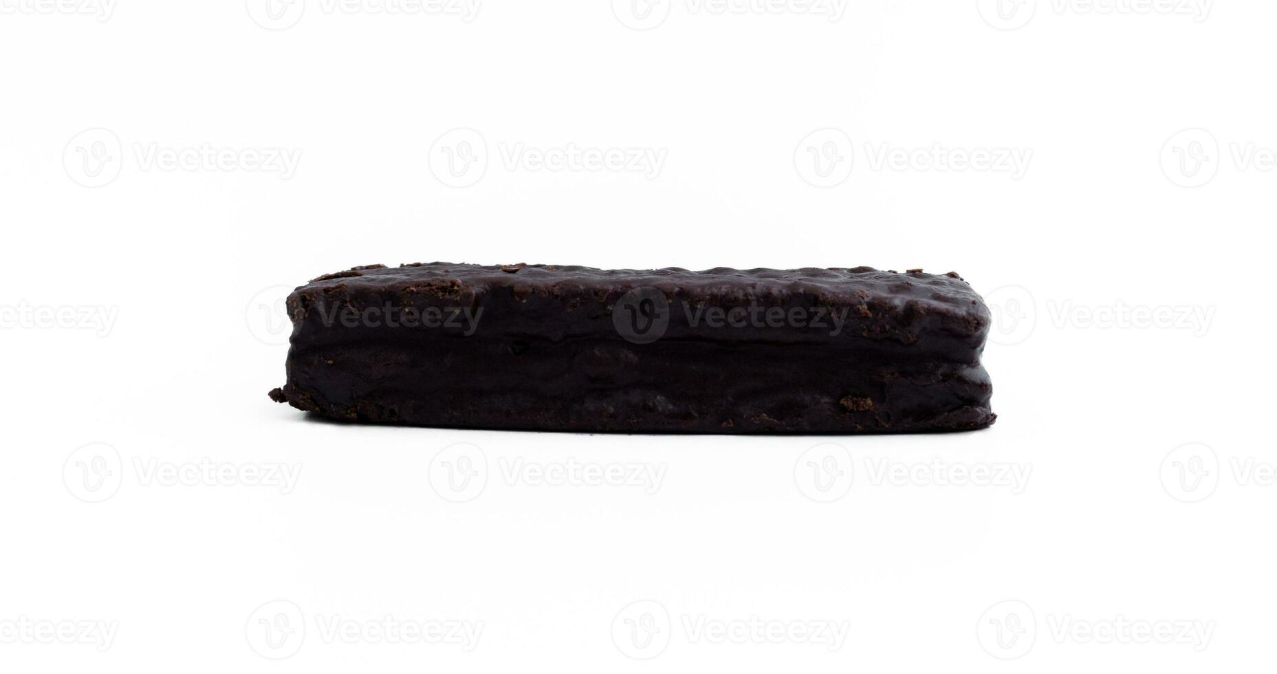 A chocolate soft cake filled with vanilla cream isolated on white background, after some edits. photo