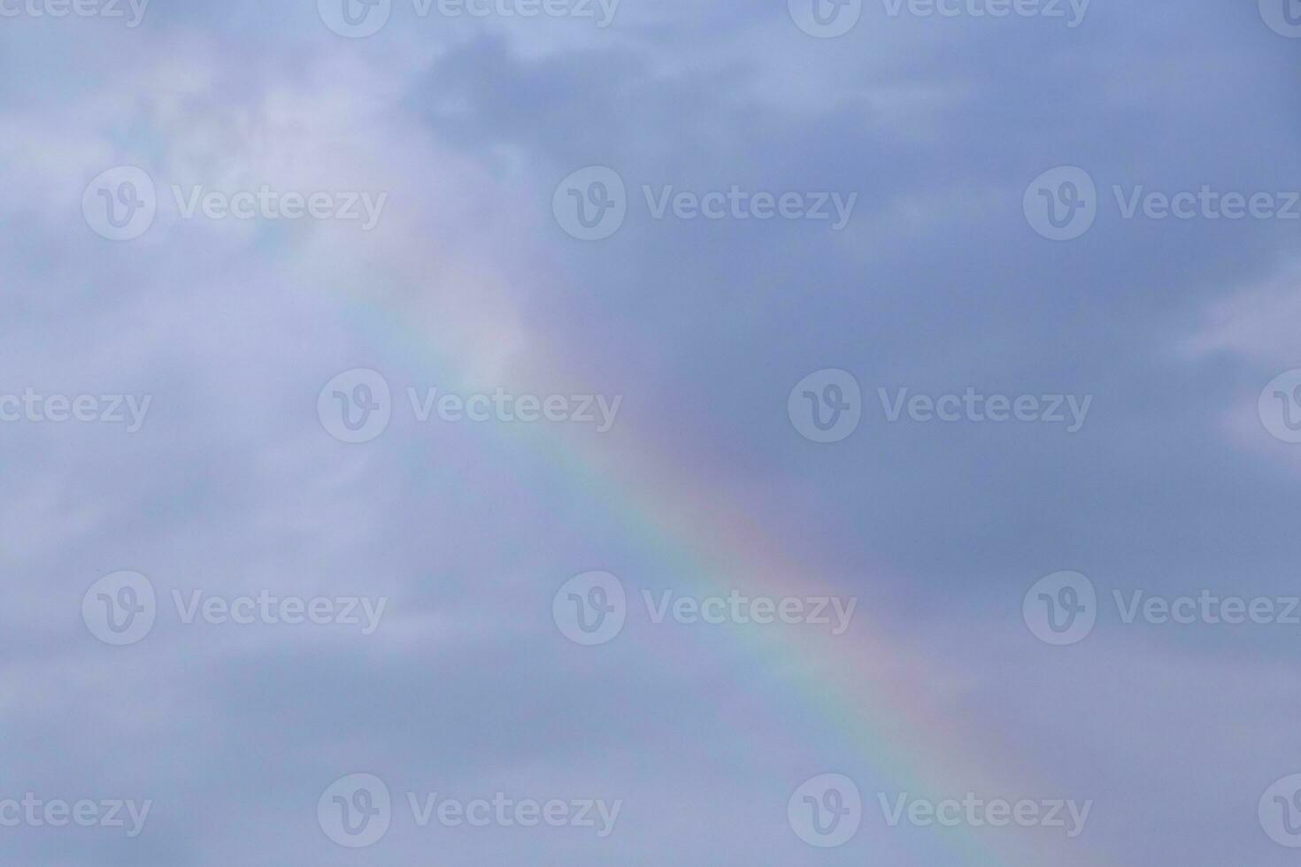 rainbow in a cloudy sky photo