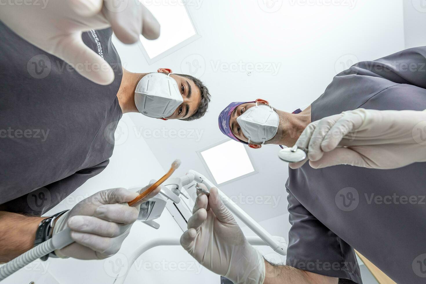 Dentist and assistant ready to treat patient photo
