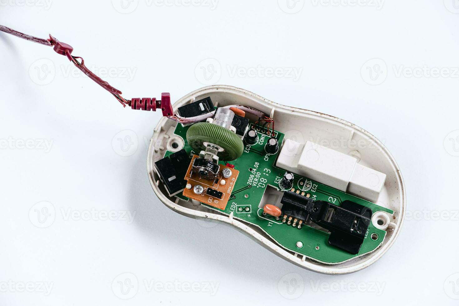 Disassembled computer mouse on white background. Gadget repair. photo