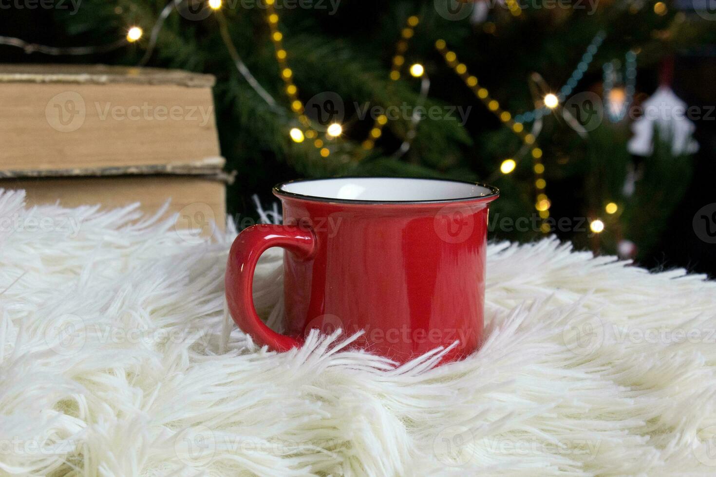 Blank red mug with christmas tree on background,tea or coffee cup with christmas and new year decoration,horizontal mock up with ceramic mug for hot drinks,empty gift print template photo