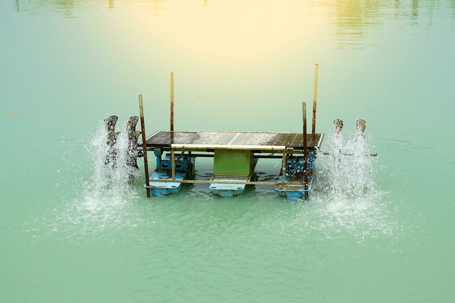 A water turbine while spinning adds air to treat the waste water in the pool. soft and selective focus. photo