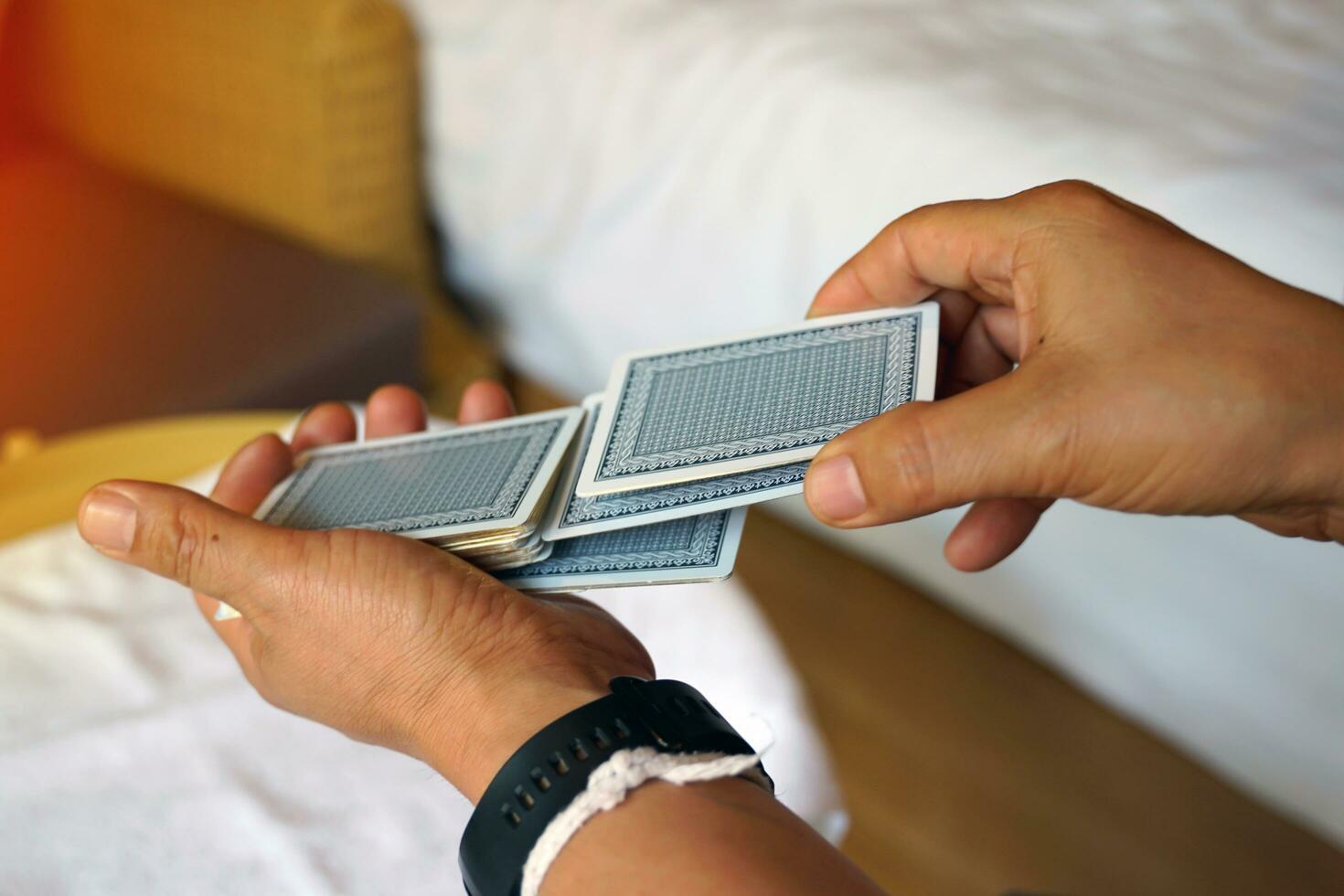 Close-up shot of the dealer's shuffling to clear the cards before the next play, concept Family leisure activities or camping. Soft and selective focus. photo