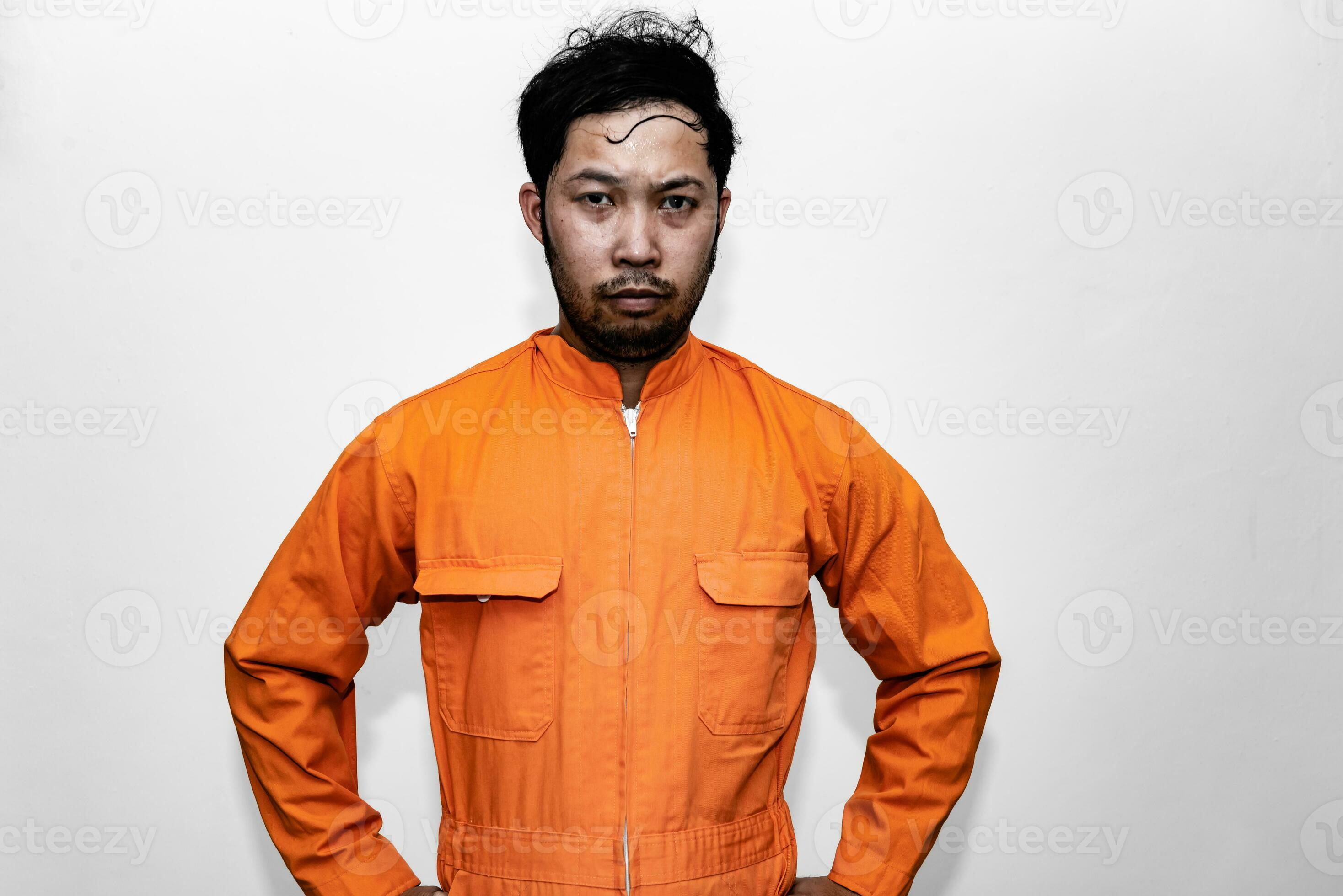 Prisoner in orange robe concept,Portrait of asian handsome man in