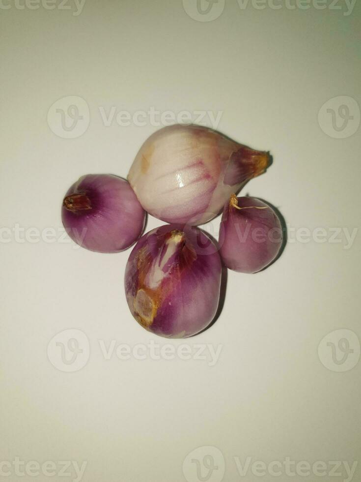 Red Onions Bawang Merah or shallots on a white background. photo