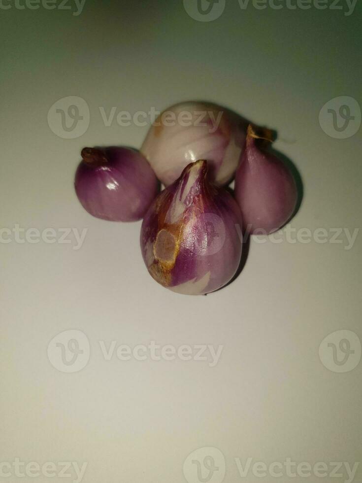 Red Onions Bawang Merah or shallots on a white background. photo