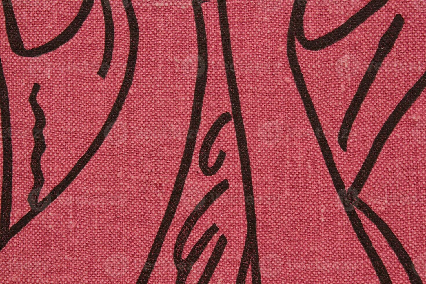 Abstract design background of pink coarse-grained intersection texture of rough fabric with an interlacing black painted lines. Linen sack textile canvas burlap cloth. Close-up, mock up, top view photo