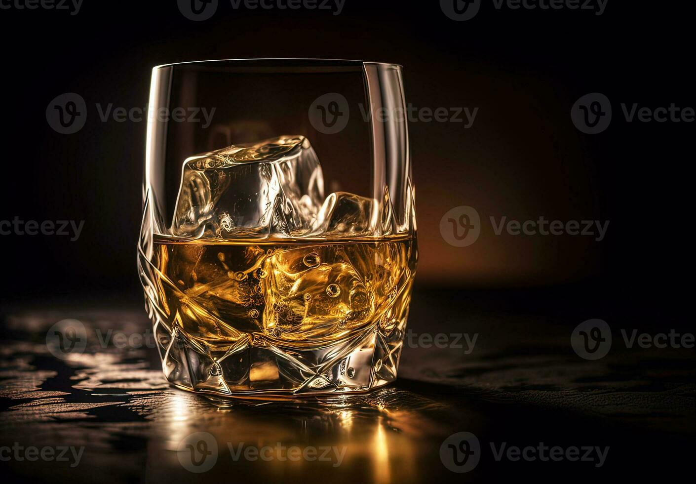 Whiskey with ice in glass on black background photo