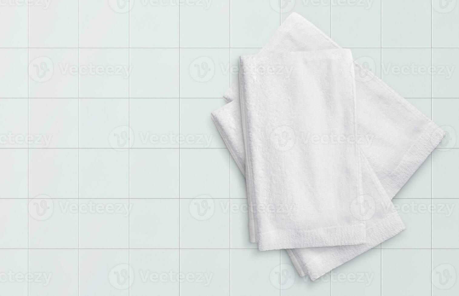 white towel on white tile photo