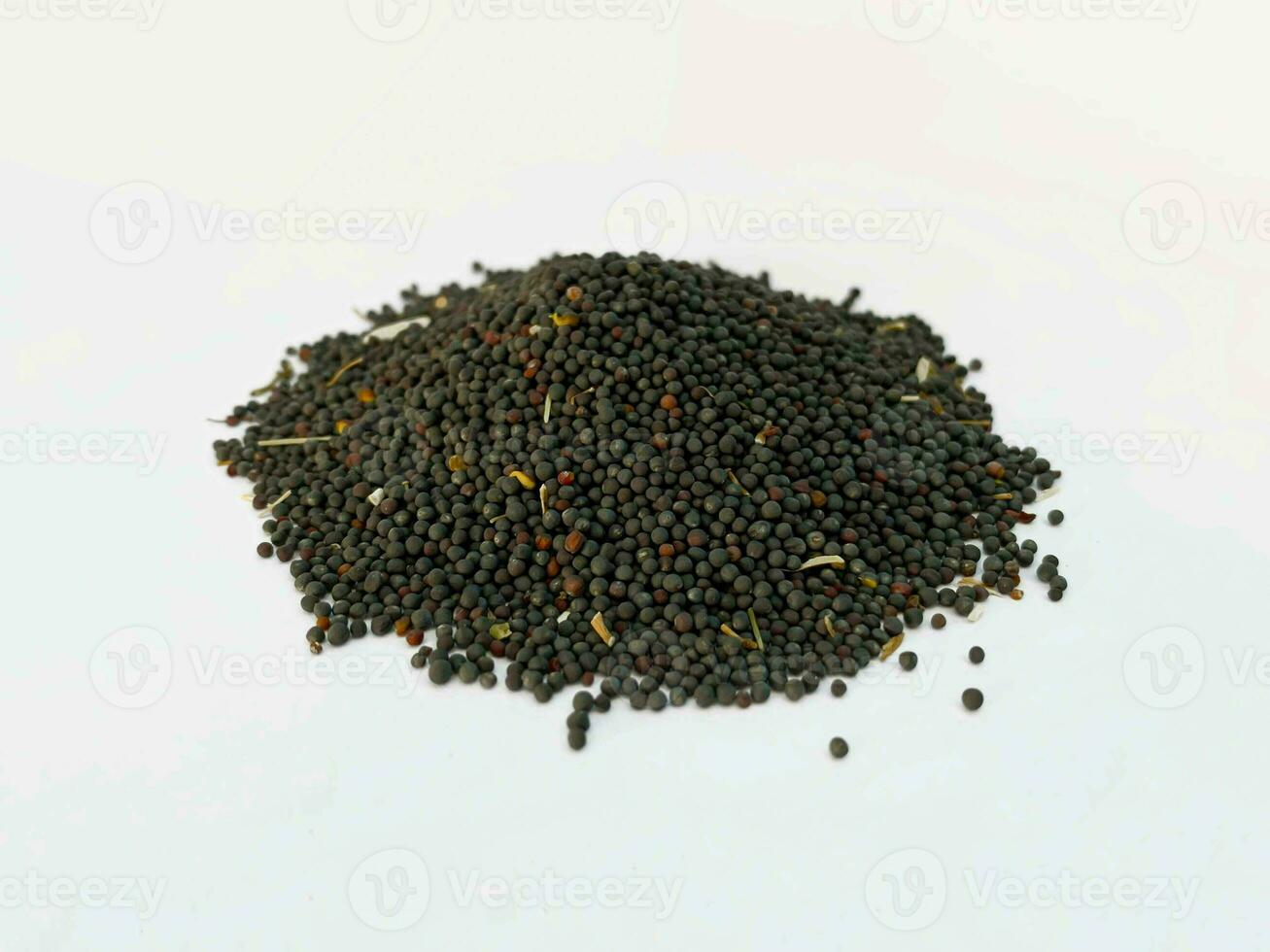 Rapeseed pile on white background photo