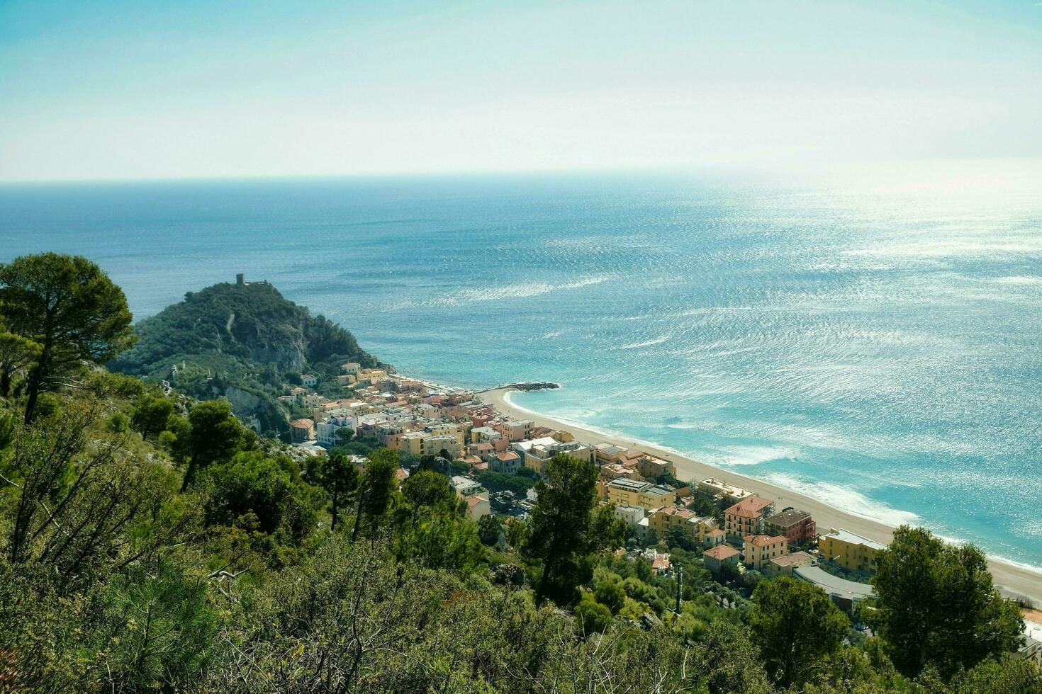 landscape of the medieval village of Varigotti and its coast on a hot summer day photo