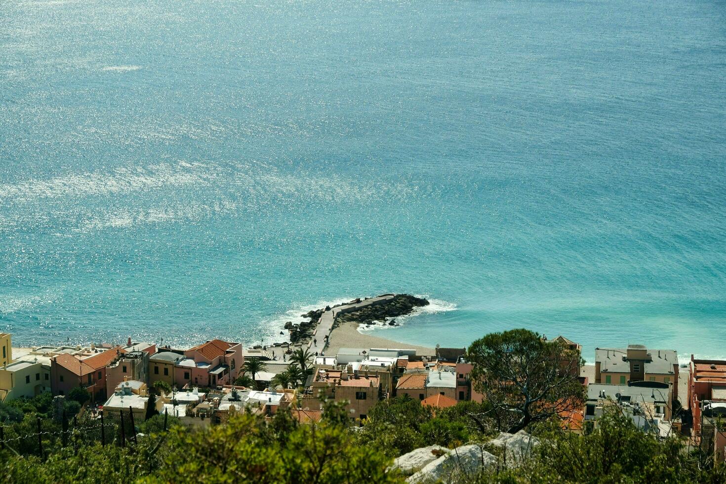 landscape of the medieval village of Varigotti and its coast on a hot summer day photo