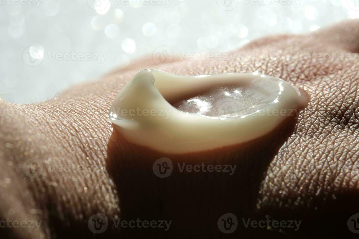 A smear of moisturizer on the hand. photo