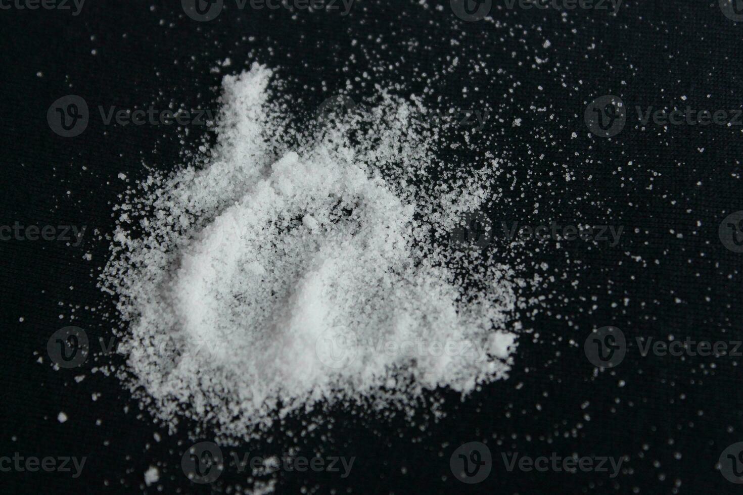 salt powder on a black background. photo