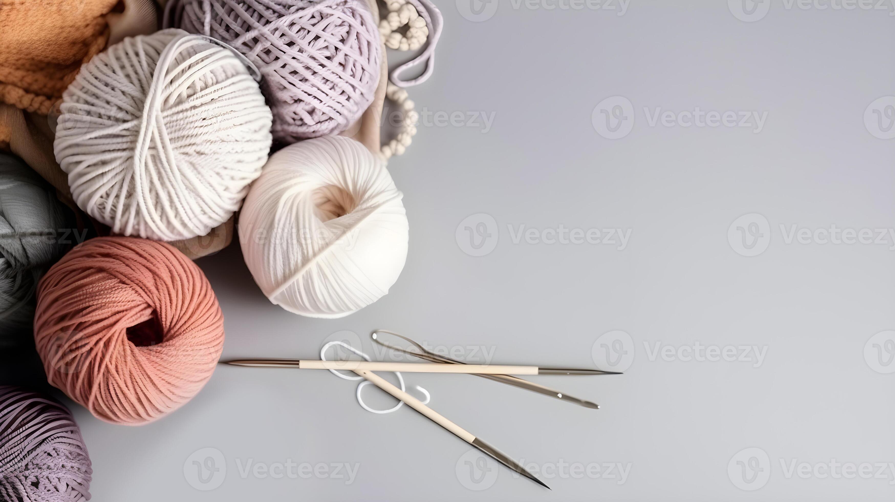 Crochet and knitting hobby. Colorful balls of yarn, knitting needles on