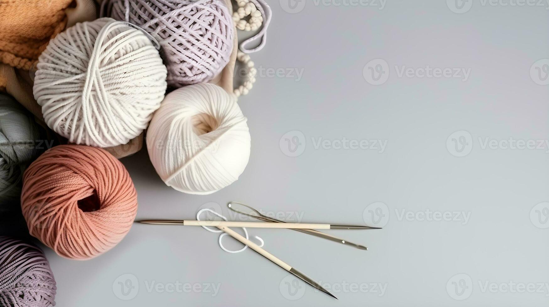 Crochet and knitting hobby. Colorful balls of yarn, knitting needles on table, with copy space, flat lay, and wood background. photo