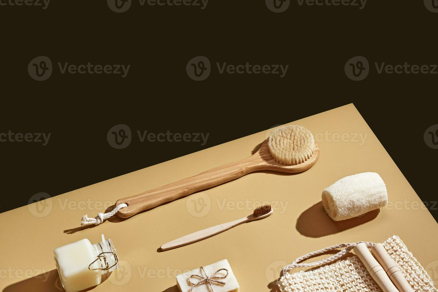 Natural hygiene products background. Bathroom composition with different brushes, soap, washcloth and cosmetic products. Isometric view, copy space photo