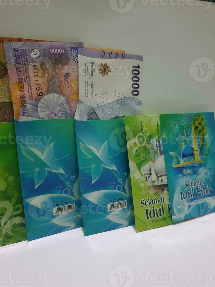 THR envelope containing money to be given to children or family or relations during Eid al-Fitr. photo