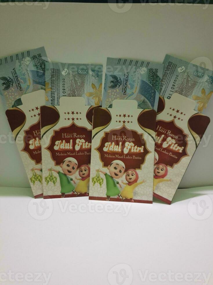 THR envelope containing money to be given to children or family or relations during Eid al-Fitr. photo