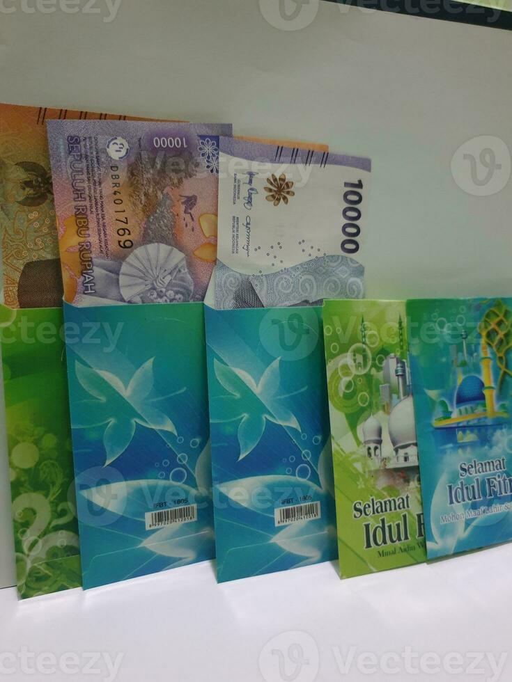 THR envelope containing money to be given to children or family or relations during Eid al-Fitr. photo