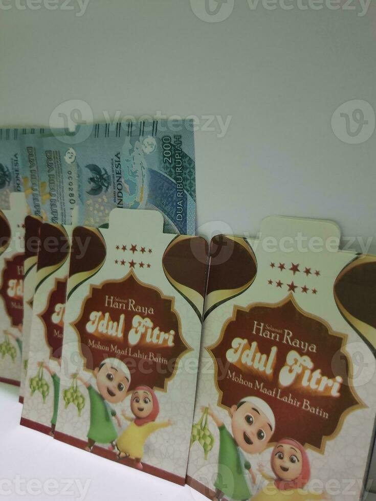 THR envelope containing money to be given to children or family or relations during Eid al-Fitr. photo