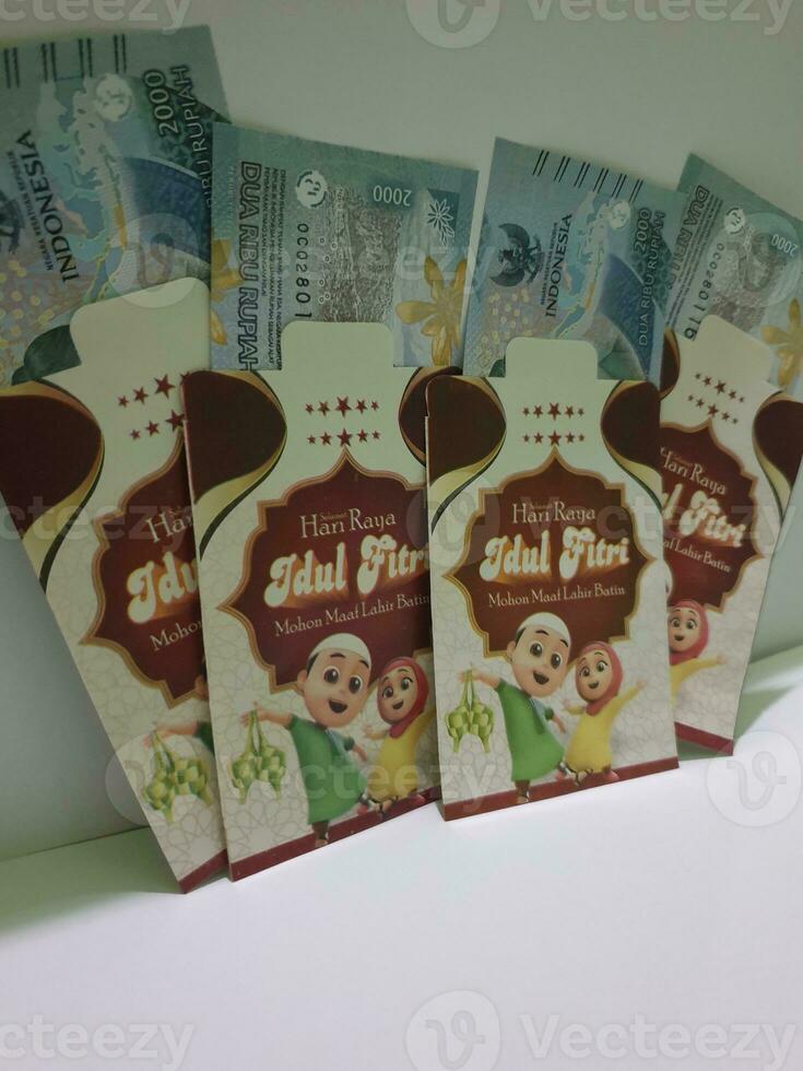 THR envelope containing money to be given to children or family or relations during Eid al-Fitr. photo