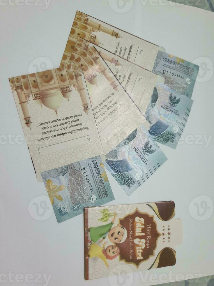 THR envelope containing money to be given to children or family or relations during Eid al-Fitr. photo