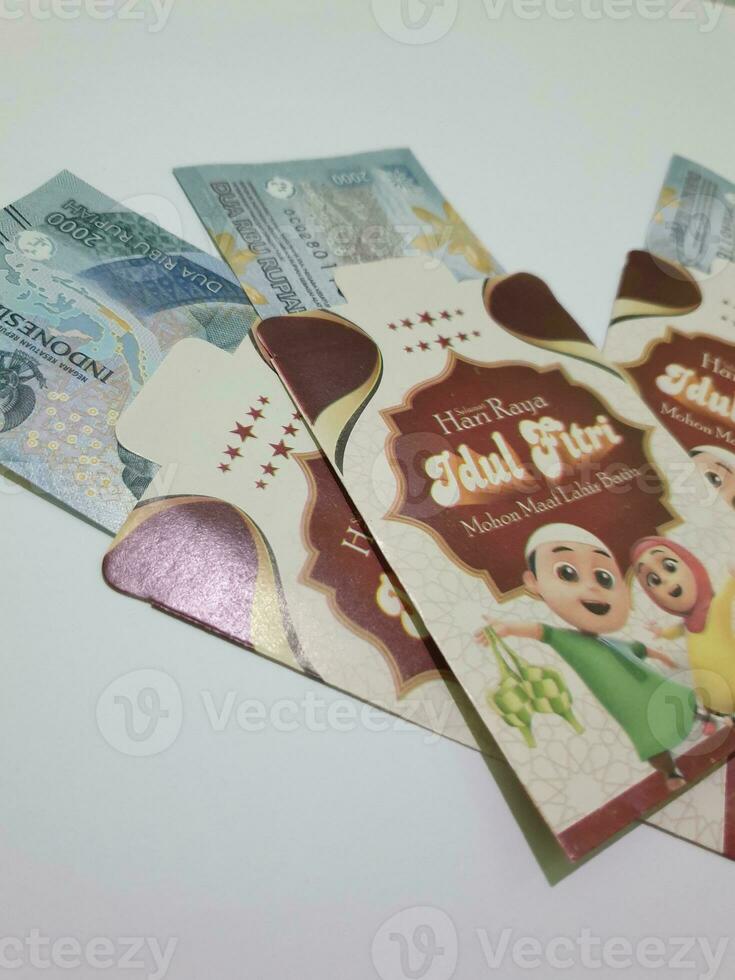 THR envelope containing money to be given to children or family or relations during Eid al-Fitr. photo