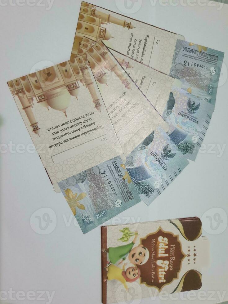 THR envelope containing money to be given to children or family or relations during Eid al-Fitr. photo